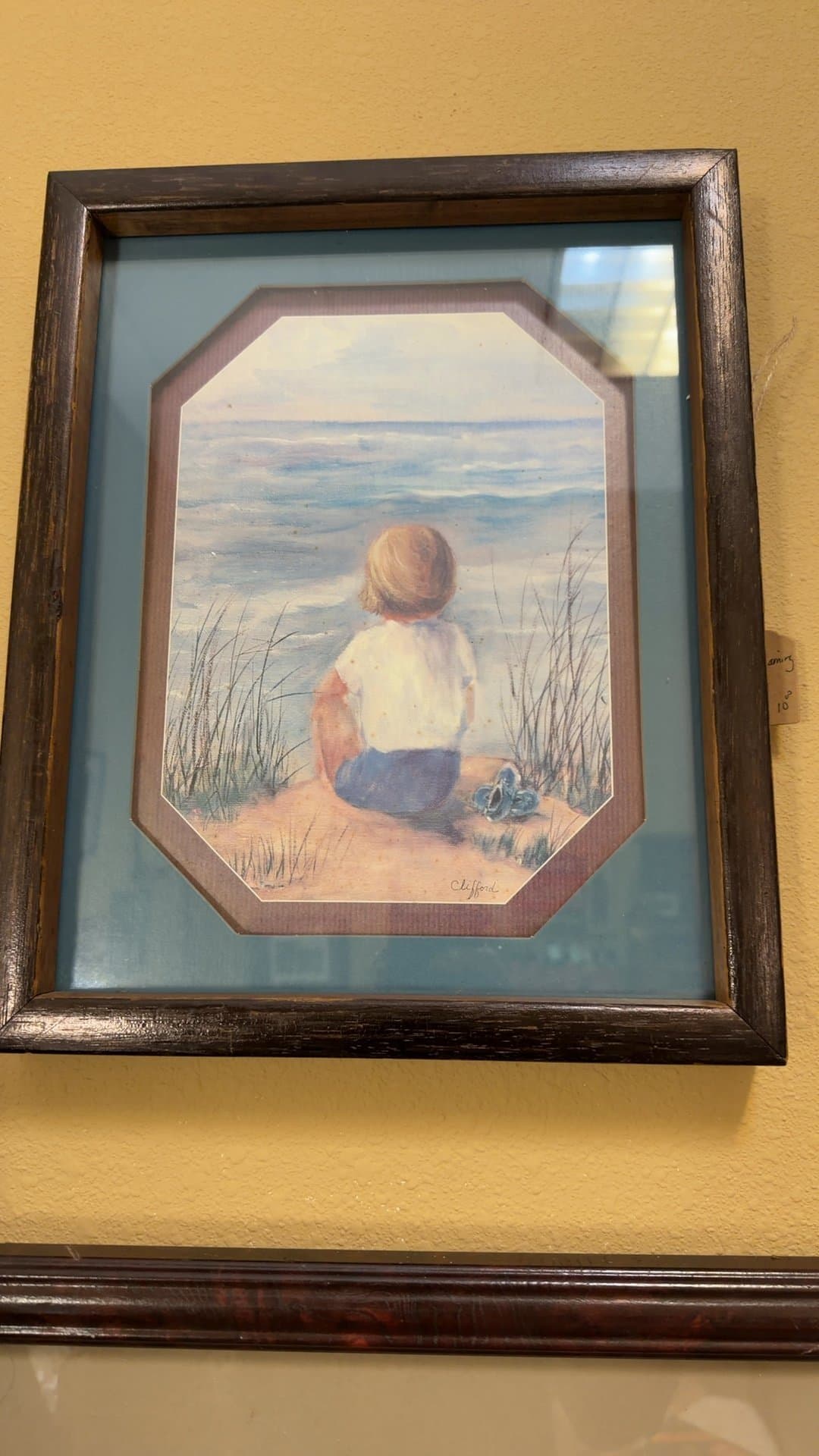 Framed Painting of Child by the Sea - Image 1