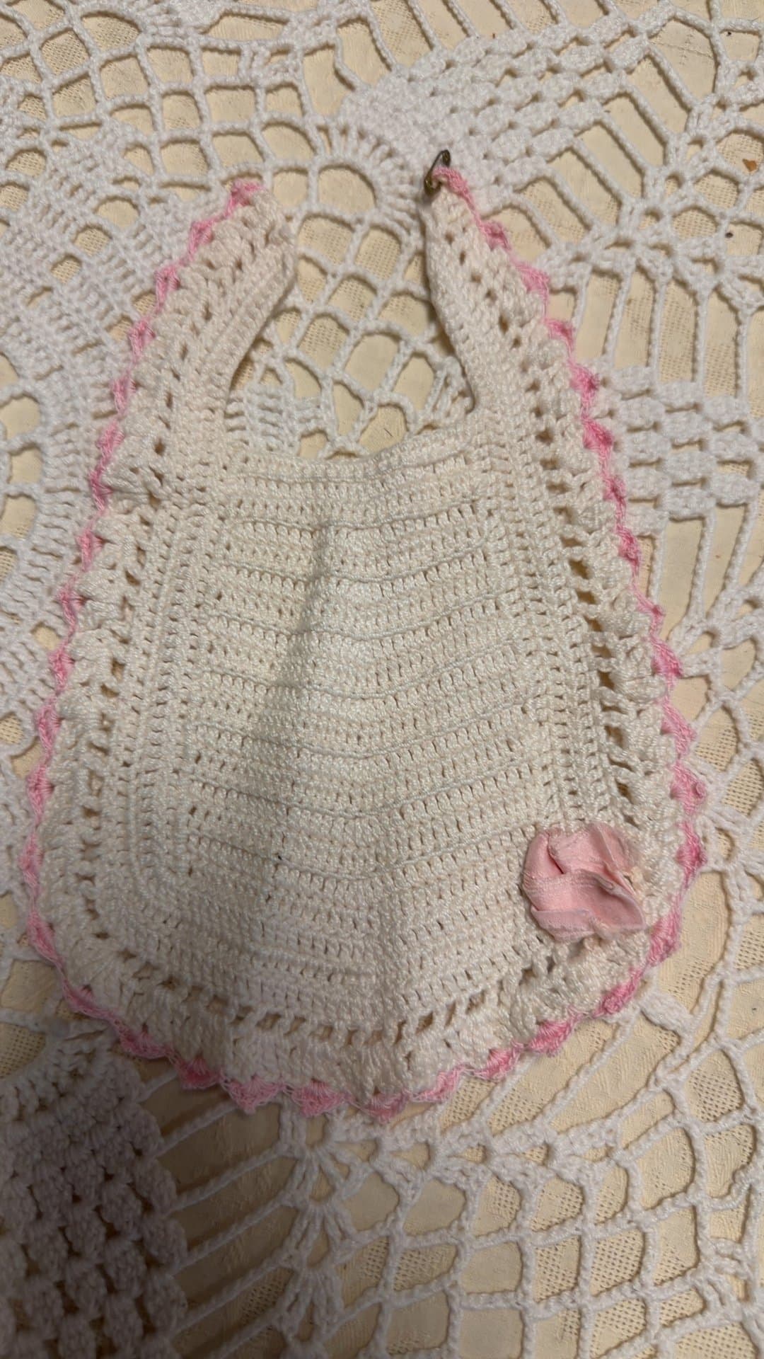 Vintage 1950's Hand-Crocheted Baby Bib with Pink Trim and Rosette - Image 1