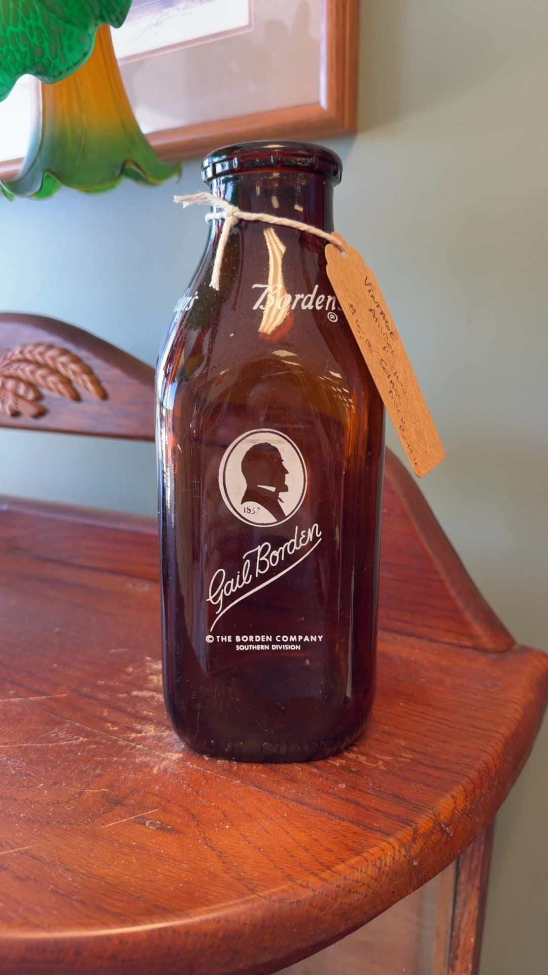 Vintage Amber Glass Gail Borden Milk Bottle - Image 1