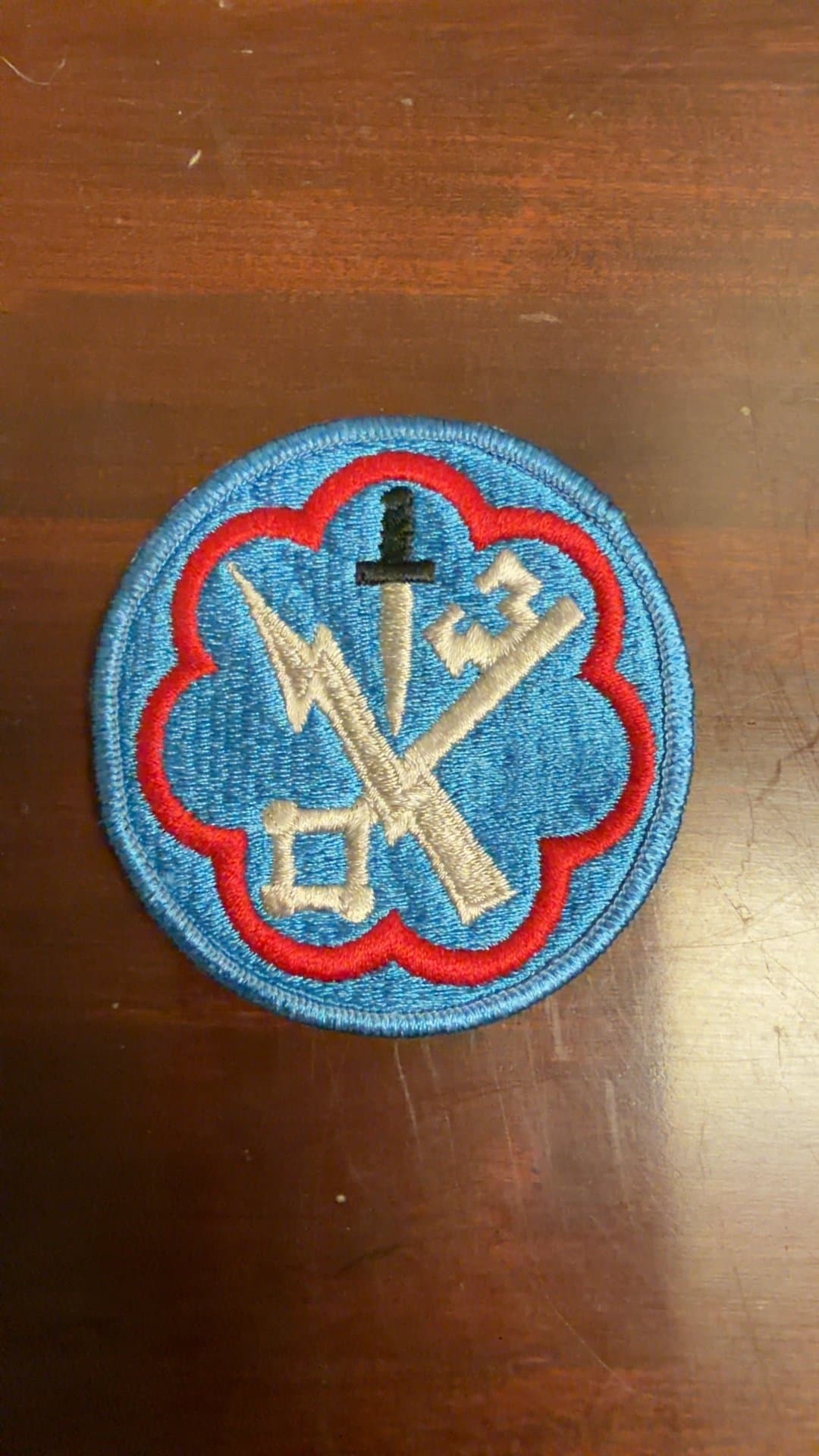 Vintage Military Patch with Sword and Lightning Bolt Emblem - Image 1