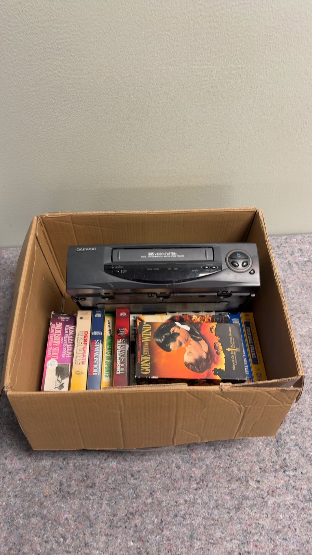 Daewoo VHS Player with Assorted VHS Tapes - Image 1