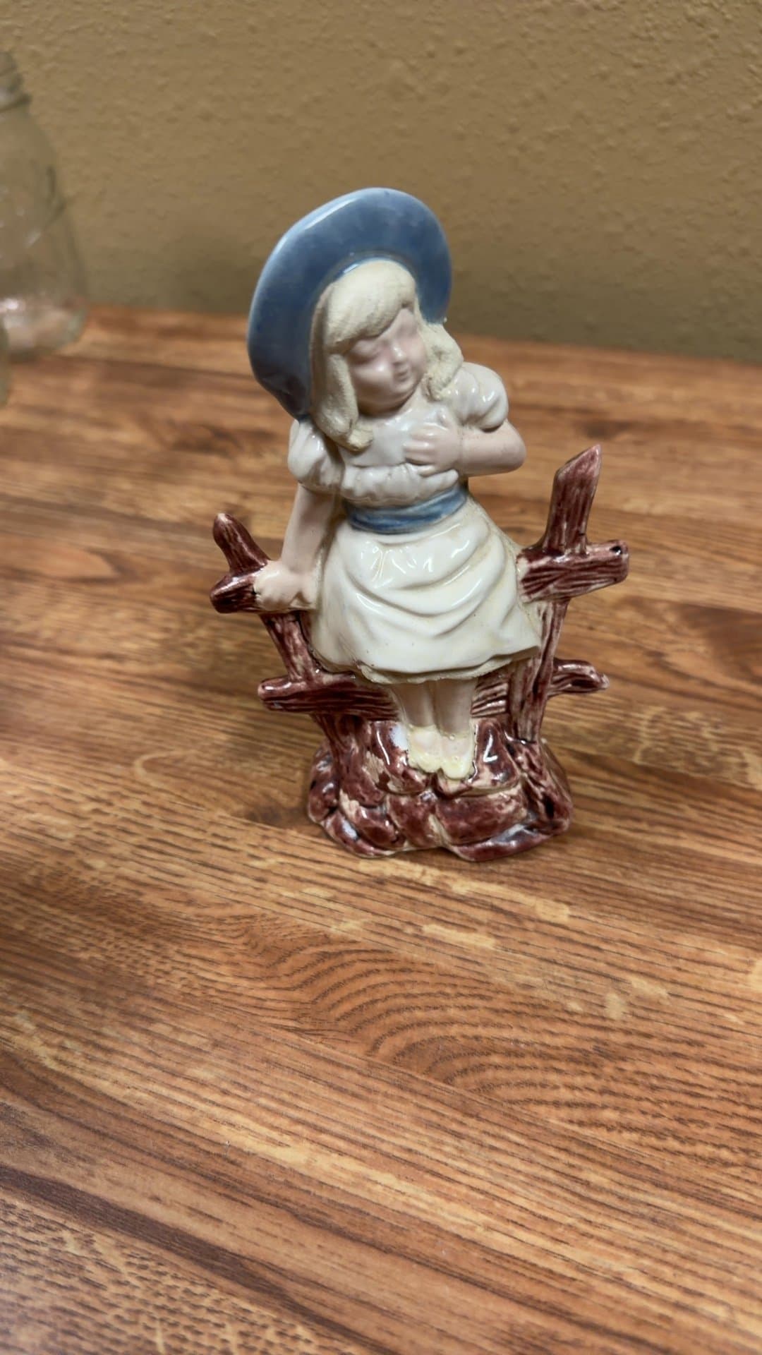 Porcelain Girl Figurine on Fence - Image 1