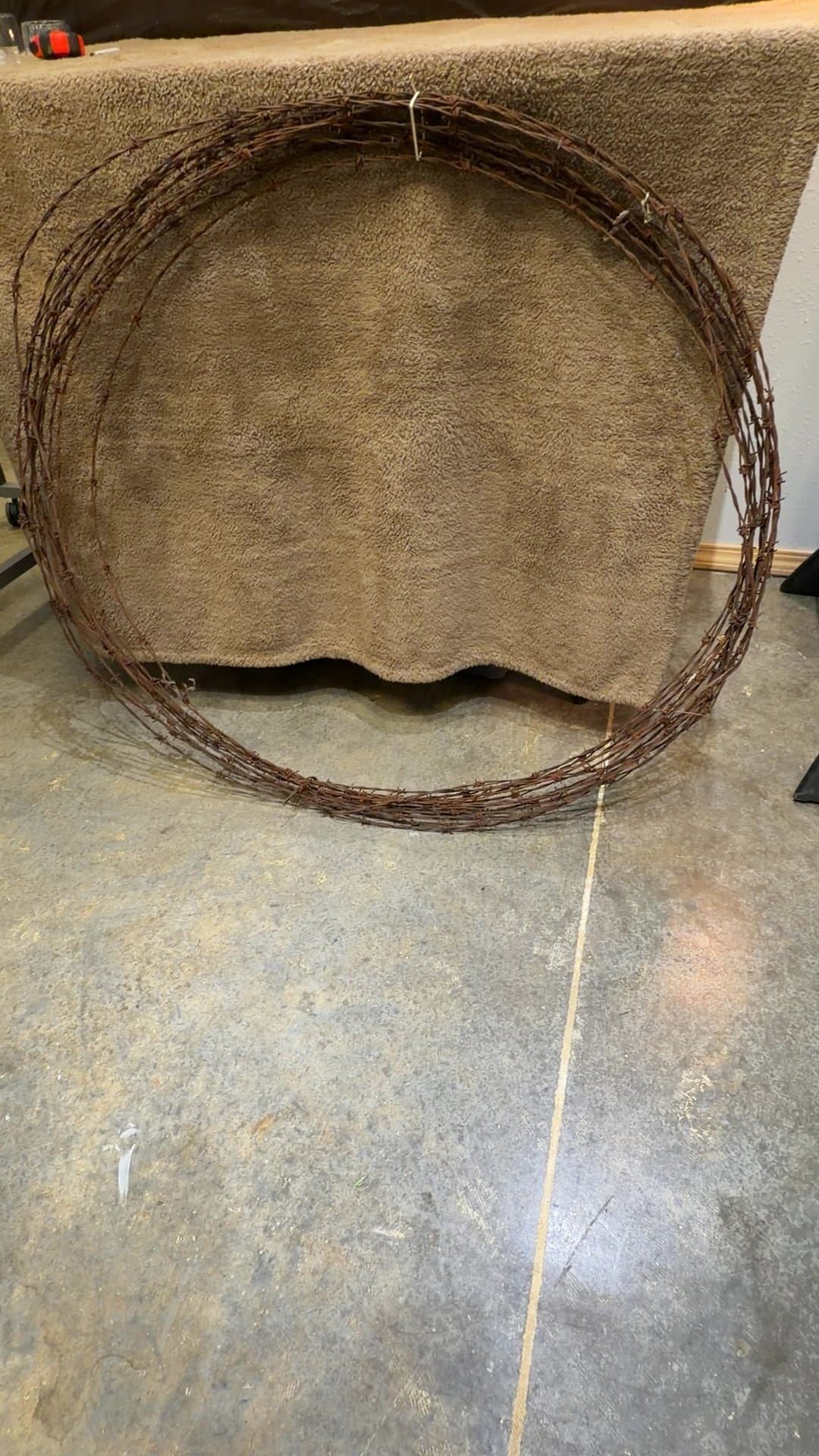 Vintage Rusty Barbed Wire Coil - Image 1