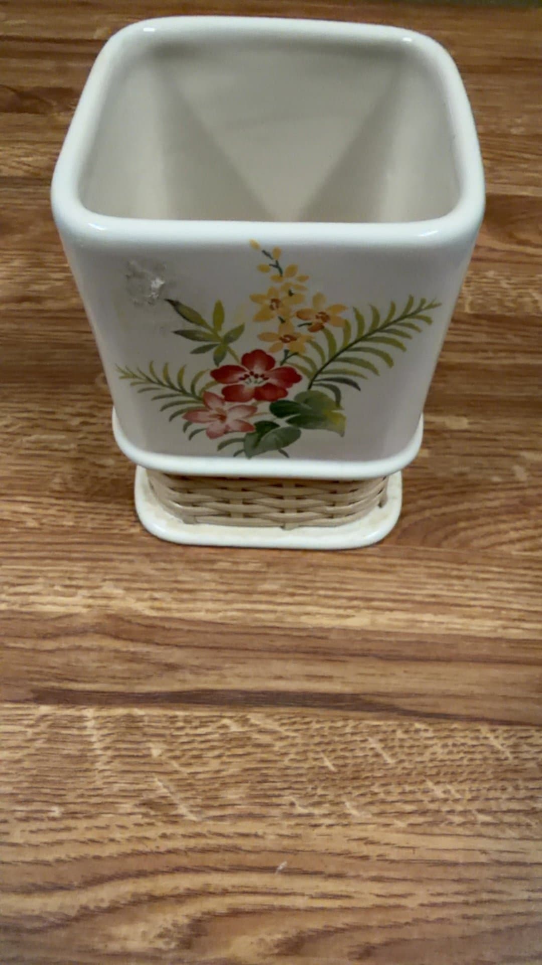 Floral Ceramic Planter with Wicker Base - Image 1