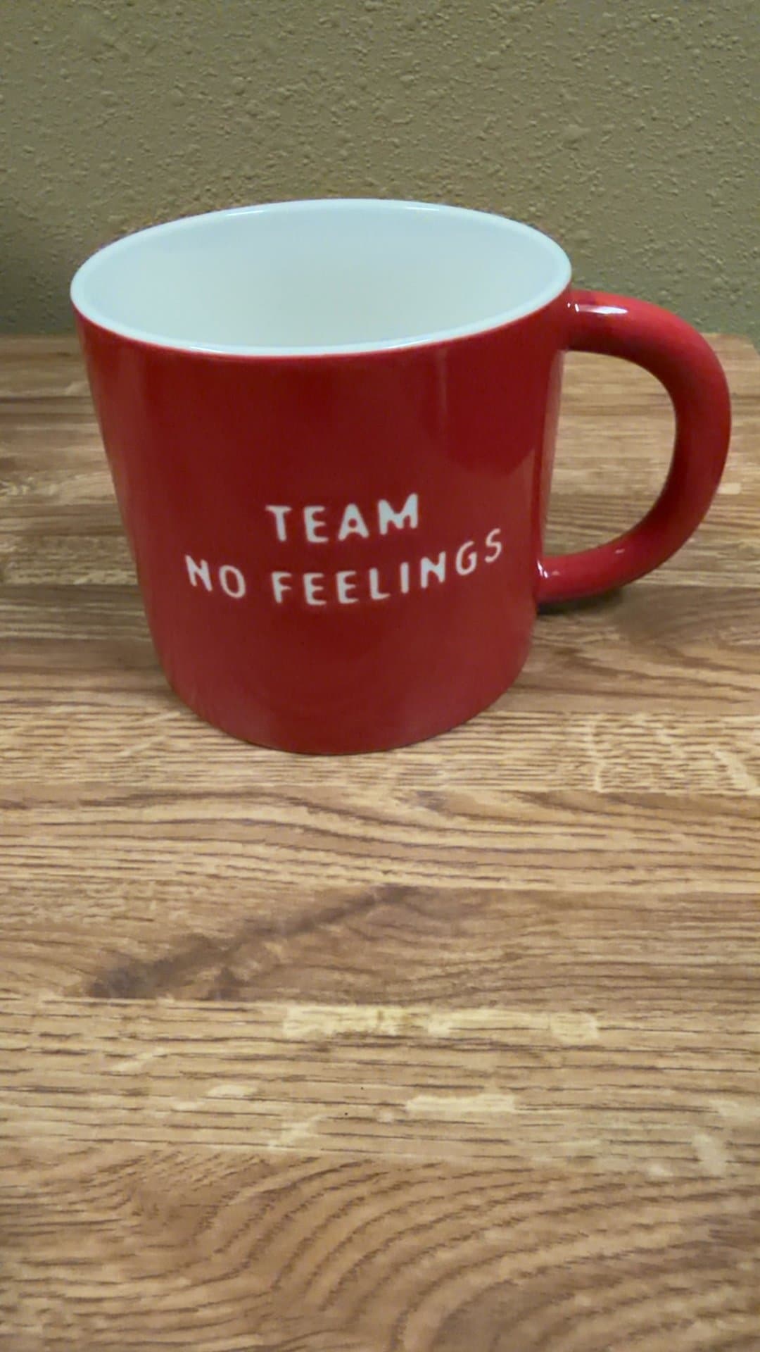 Red Ceramic Mug with 'Team No Feelings' Text - Image 1