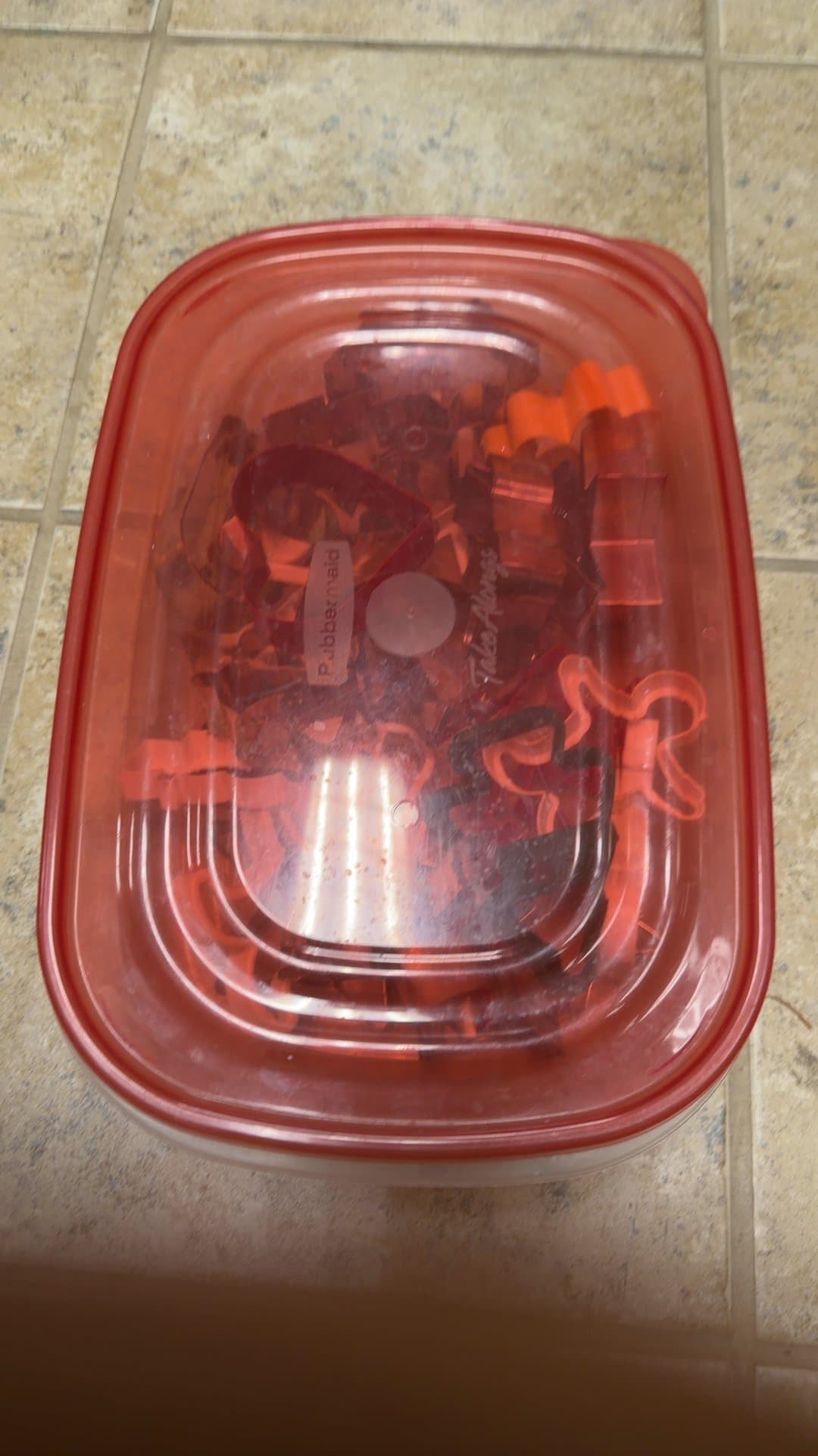 Assorted Plastic and Metal Cookie Cutters with Rubbermaid Container - Image 1