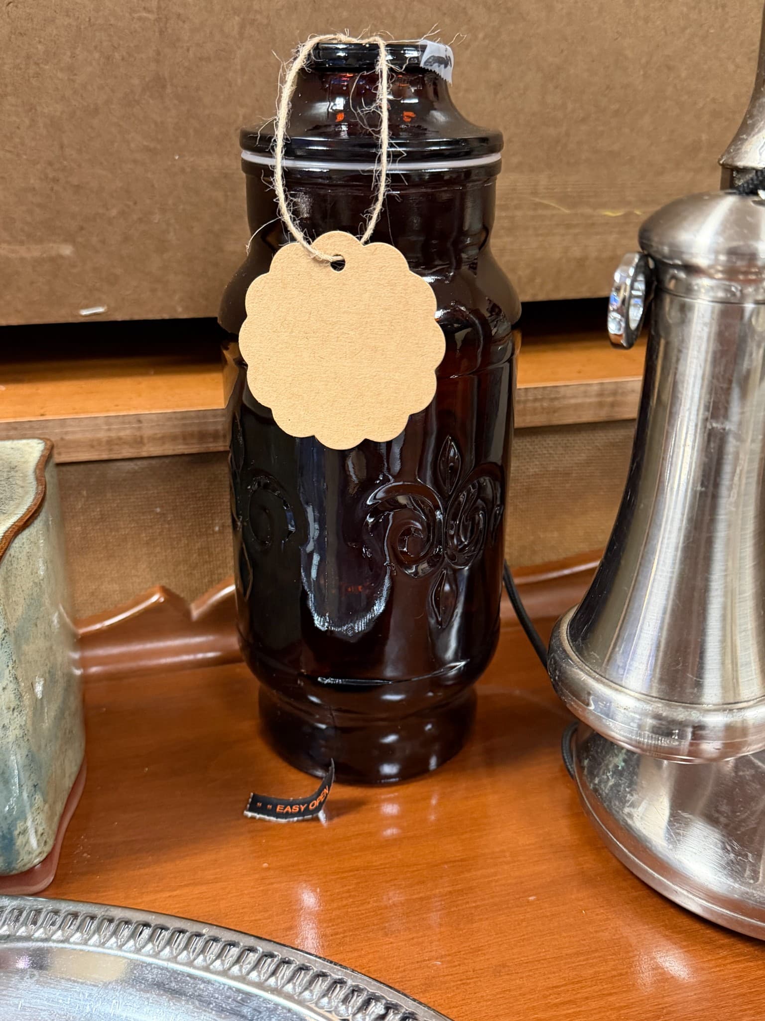 Vintage Dark Glass Jar with Fleur-de-Lis Design - Image 1