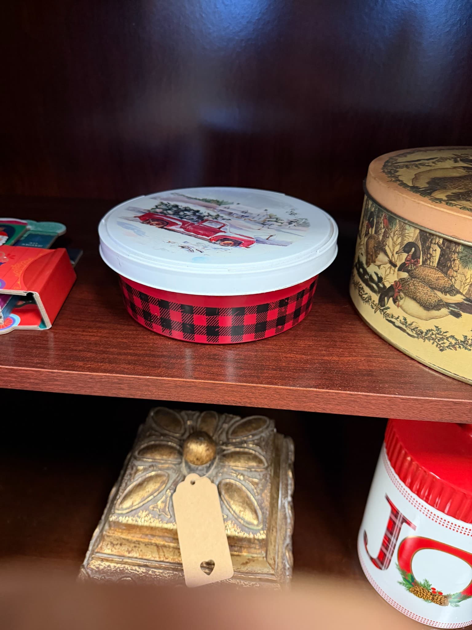 Red Plaid Christmas Tin with Truck Design - Image 1